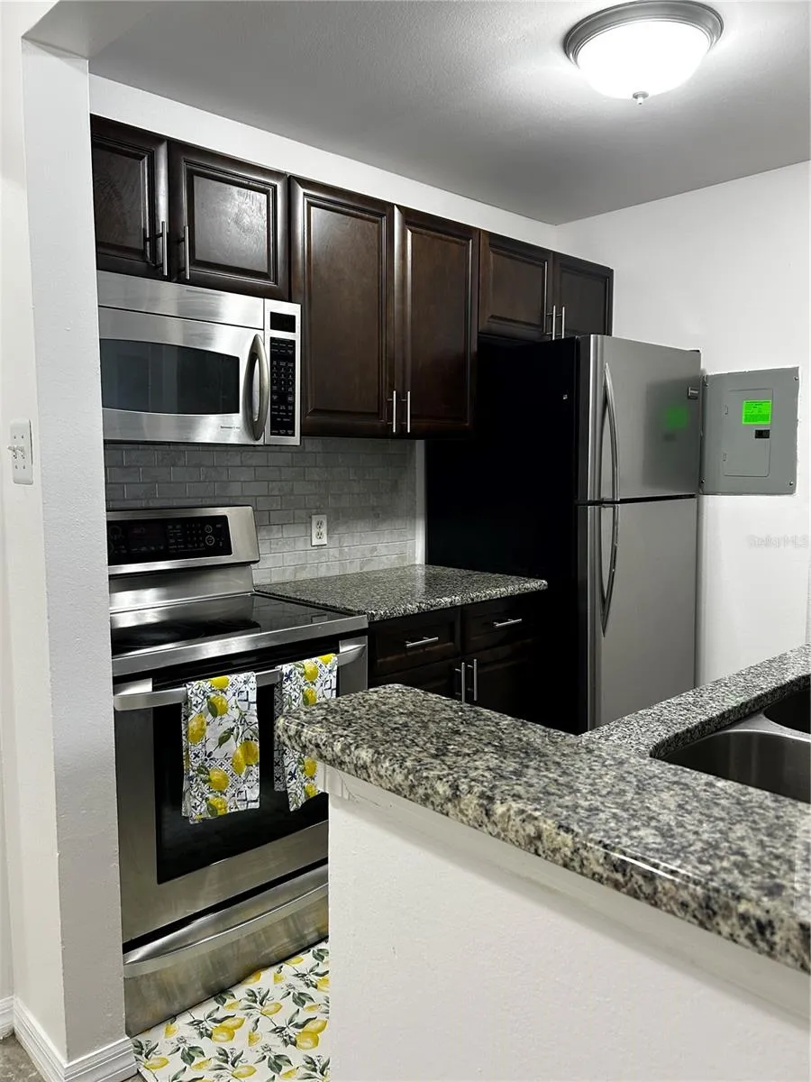 Kitchen with Granite Countertops and Stainless Steel Appliances