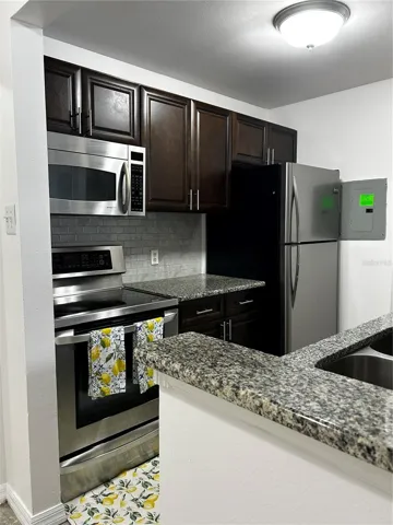 Kitchen with Granite Countertops and Stainless Steel Appliances