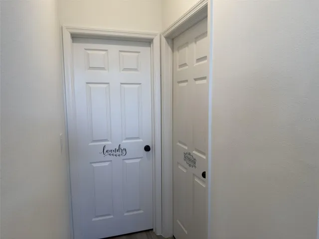 Laundry room straight ahead and bathroom to the right