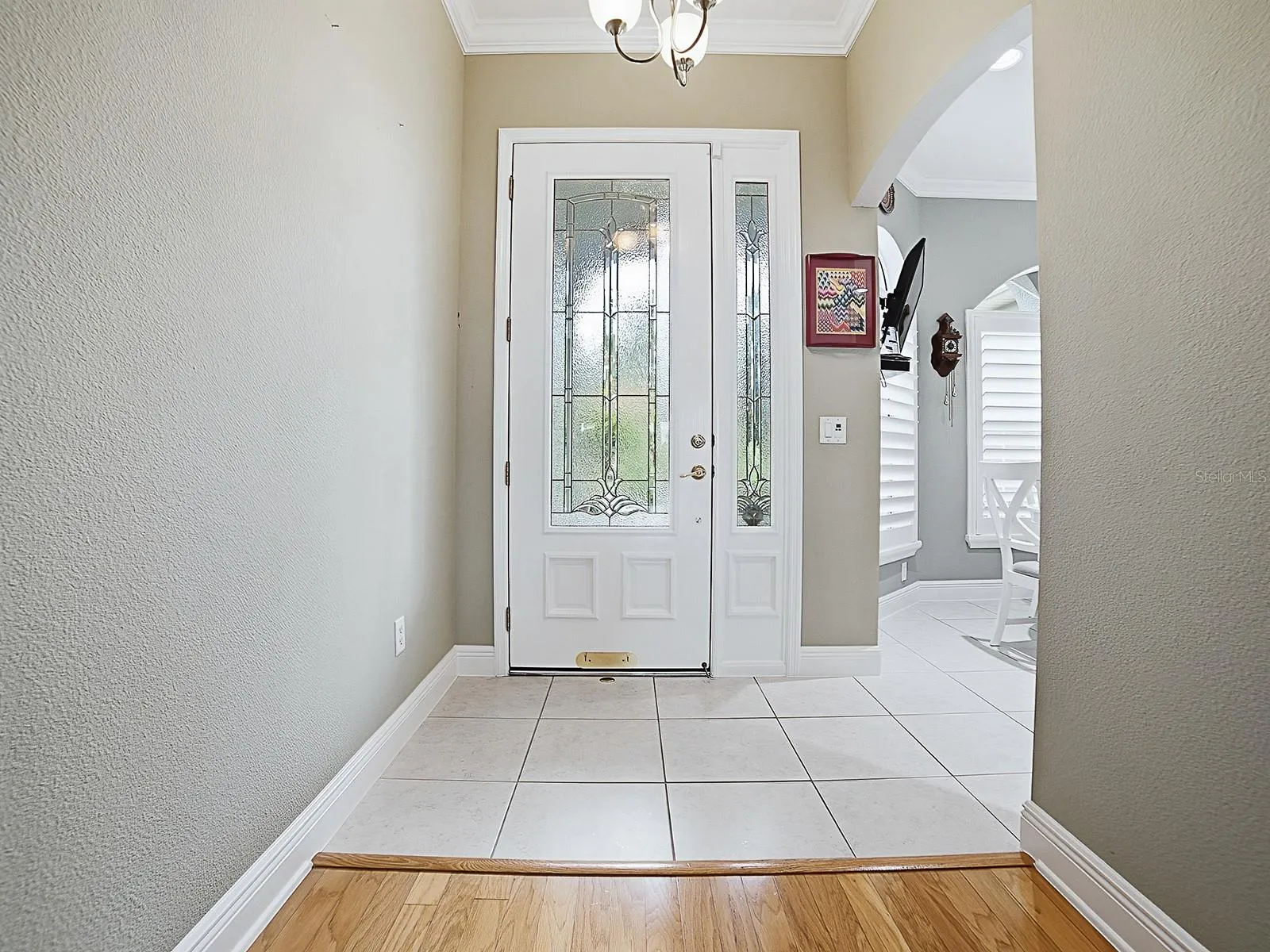 JUST AS LOVELY FROM THE INSIDE WITH TILED FOYER.