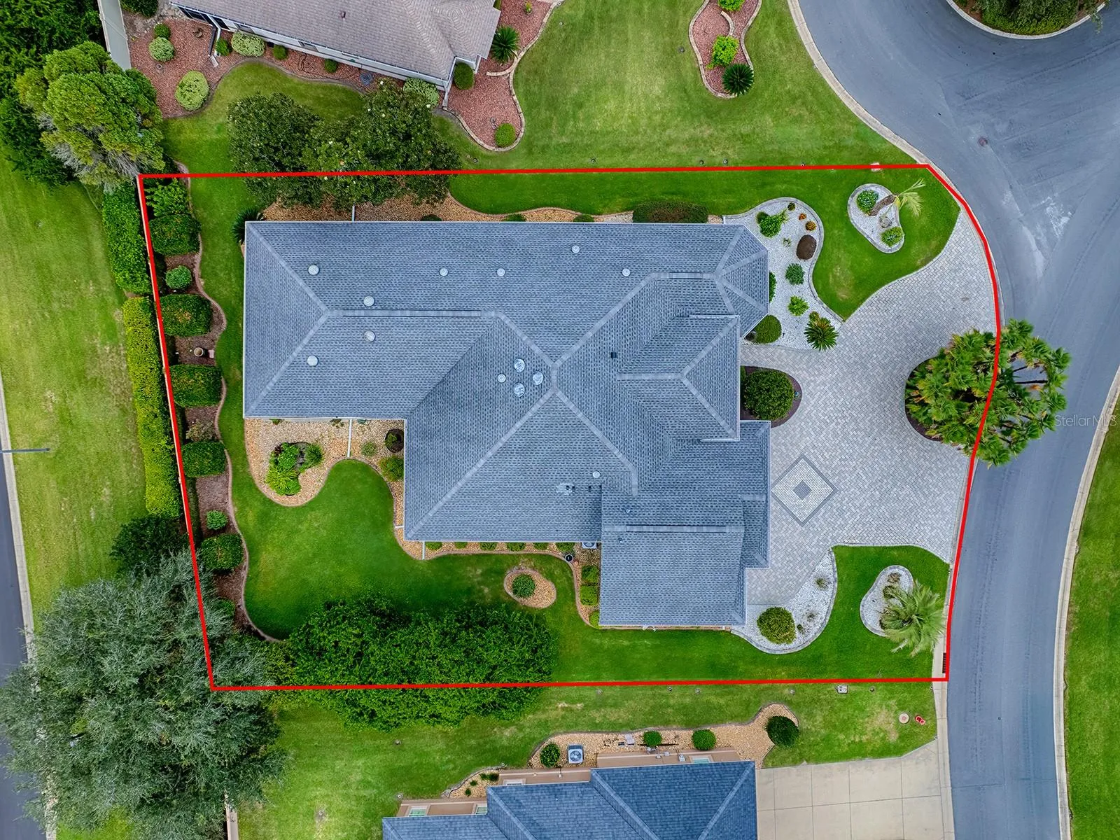 AERIAL VIEW!  PLENTY OF PARKING WITH A PAVED CIRCLE DRIVEWAY, BEAUTIFULLY LANDSCAPED AROUND THE ENTIRE HOME PROVIDING COMPLETE PRIVACY!