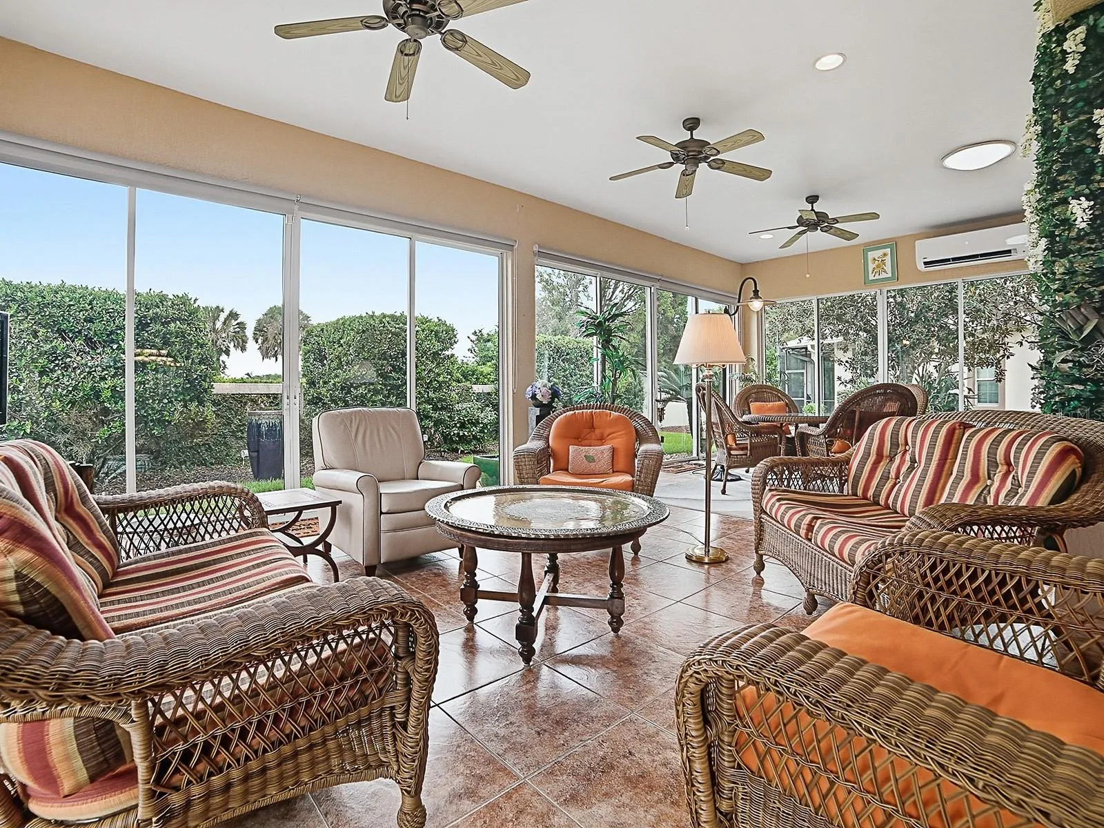 SPECTACULAR SUNROOM WITH LOVELY TILE FLOORING, A MINI-SPLIT FOR CLIMATE CONTROL AND COMPLETE PRIVACY!