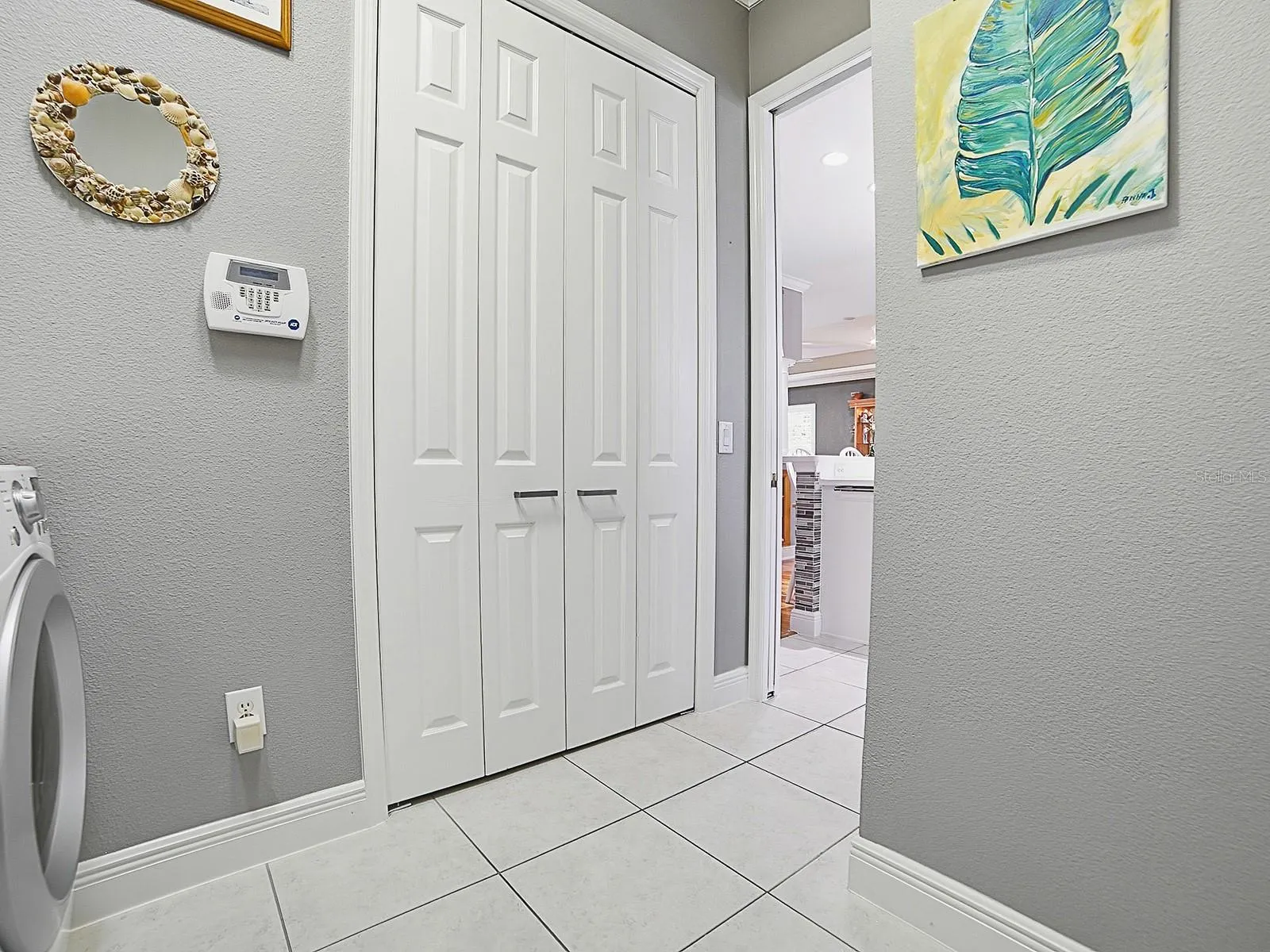 ANOTHER LARGER DOUBLE DOOR PANTRY ADDED TO THE LAUNDRY ROOM. SO MUCH STORAGE SPACE RARELY FOUND EVEN IN PREMIER HOMES.