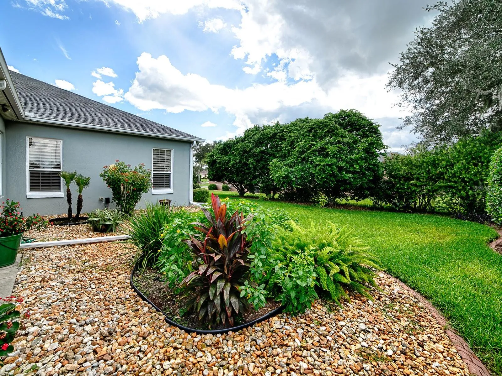 PLENTY OF ROOM OUTSIDE THE SLIDING GLASS DOORS FOR A POOL IF DESIRED!
