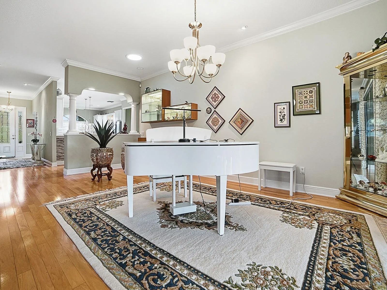 SPACIOUS DINING ROOM  --  ALSO A PERFECT PLACE FOR A PIANO!  BEAUTIFUL HARDWOOD FLOORING THROUGHOUT THE LIVING AND DINING AREA, HALLWAY, 1 GUEST ROOM, AND PRIMARY BEDROOM.