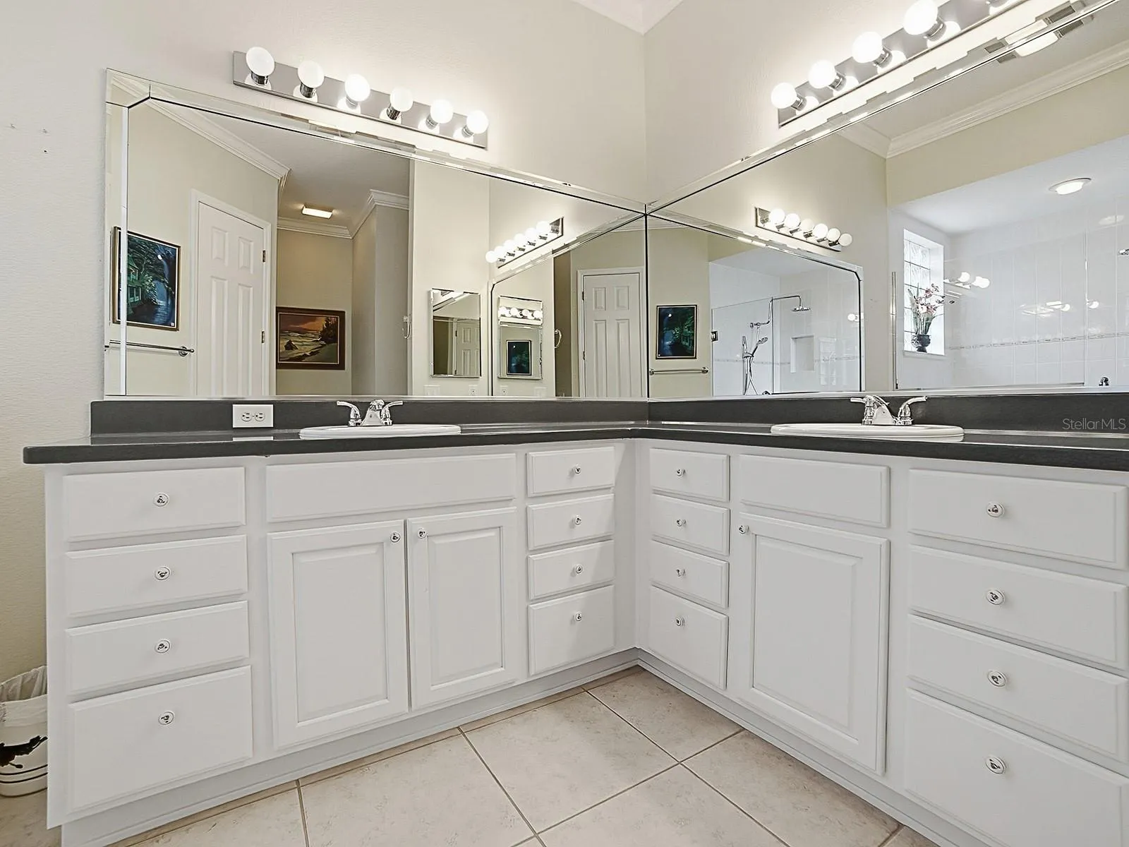 DUAL SINKS AND BEVELED EDGE MIRRORS.
