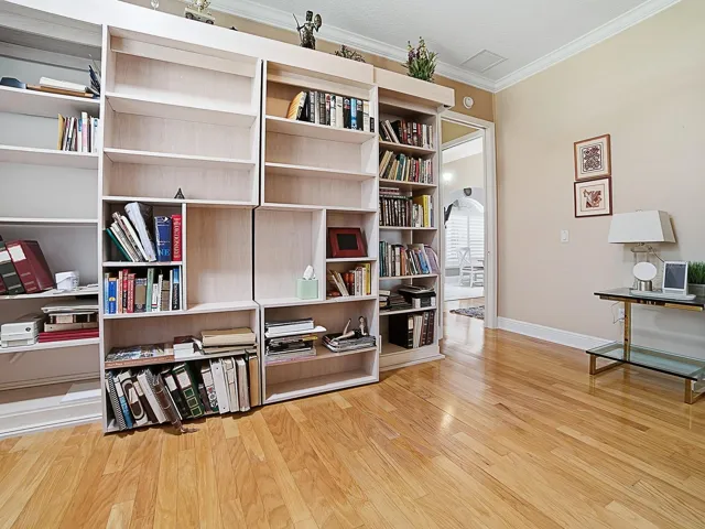 SLIDE THE BOOK SHELVES TO EITHER SIDE TO ACCESS THE MURPHY BED.