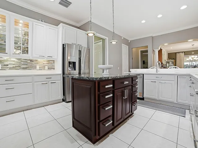 NEWER STAINLESS DISHWASHER, AND CORIAN COUNTER TOPS.