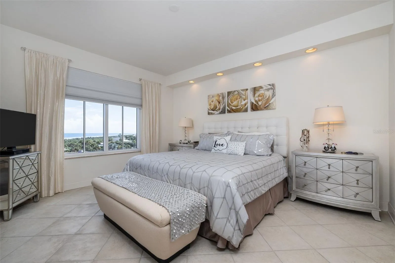 MBR features great views of the coastline & opens to balcony!