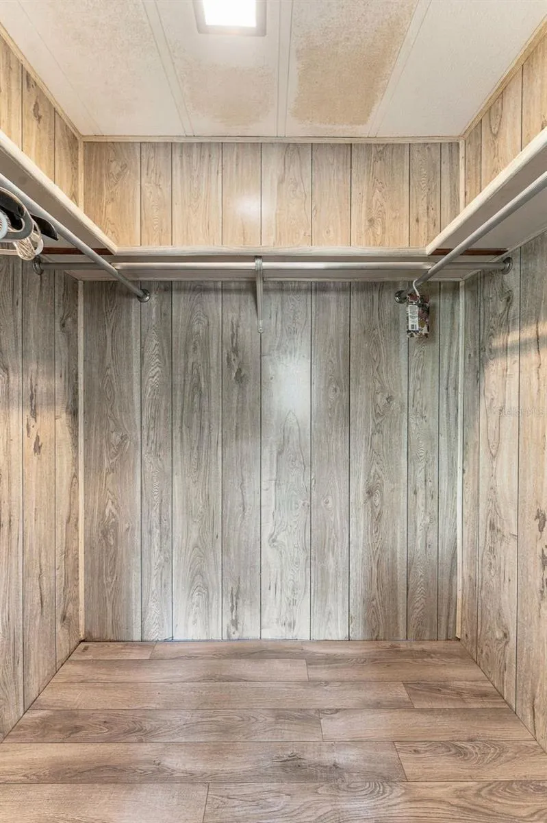Primary bedroom walk-in closet