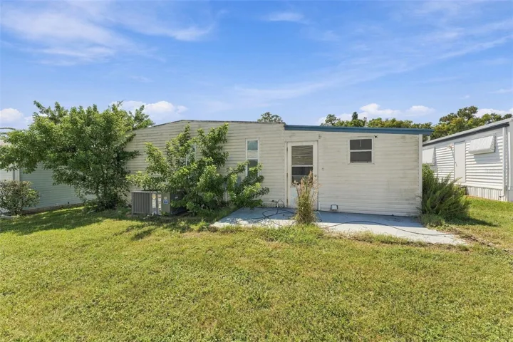 Back of unit with concrete patio area