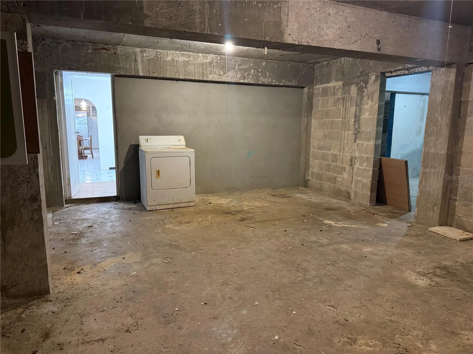 Dry storage - full of potential to be the kitchen and living room of a new unit.