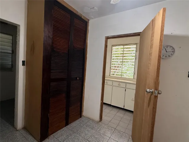 Passageway between 4th bedroom, bathroom, utility room and Kitchen.