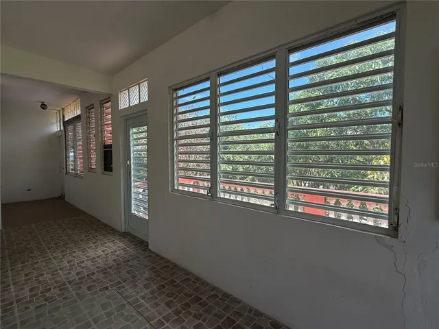 Foyer/Hallway into First Bedroom/ Balcony.