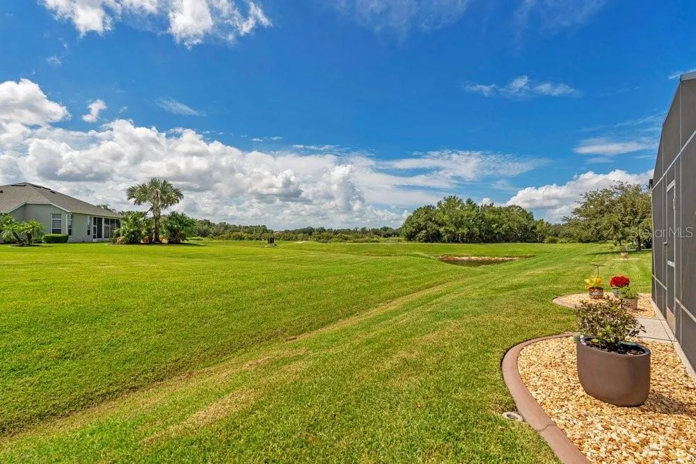 Back yard view to water/pond and trails