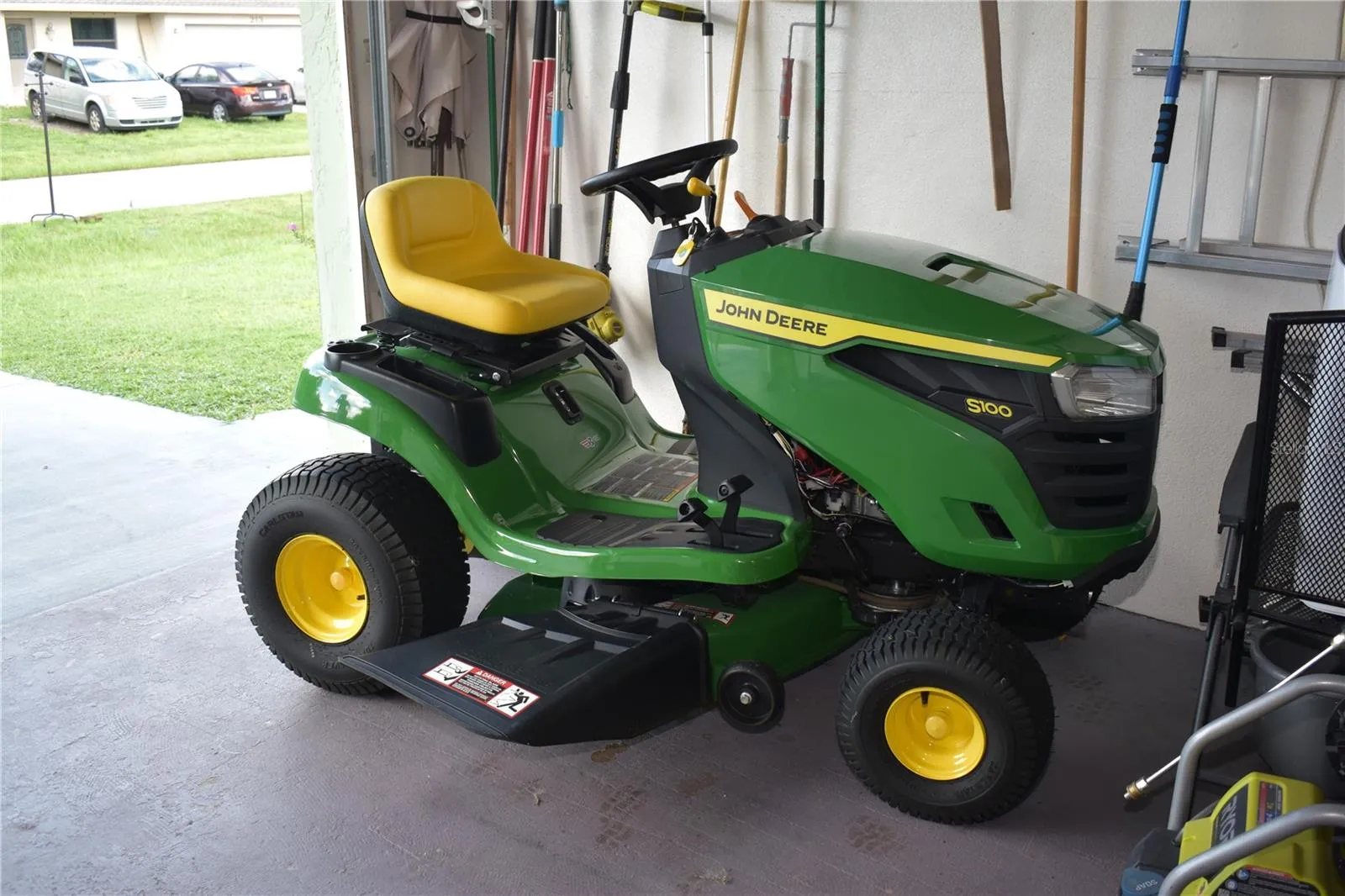 The riding lawn mower may be included with the sale of the property.