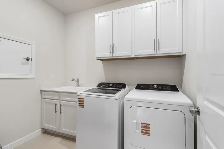 Laundry Room with sink and Cabinetry