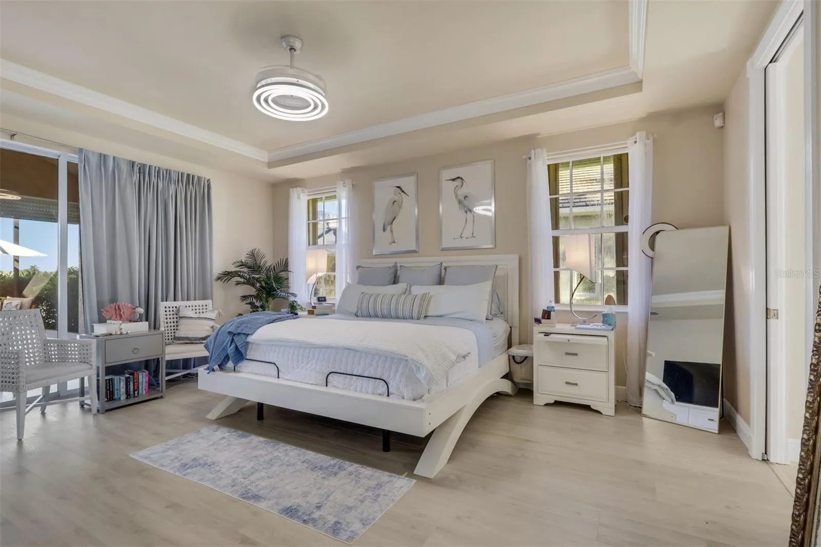 Primary Bedroom overlooking pool and lake