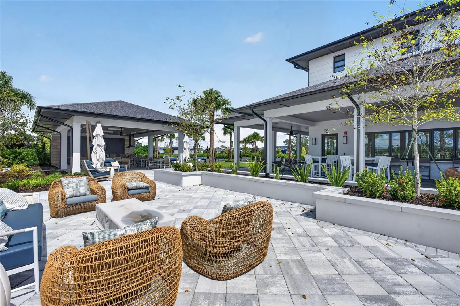 view of firepit area and outdoor dining, bar and TV