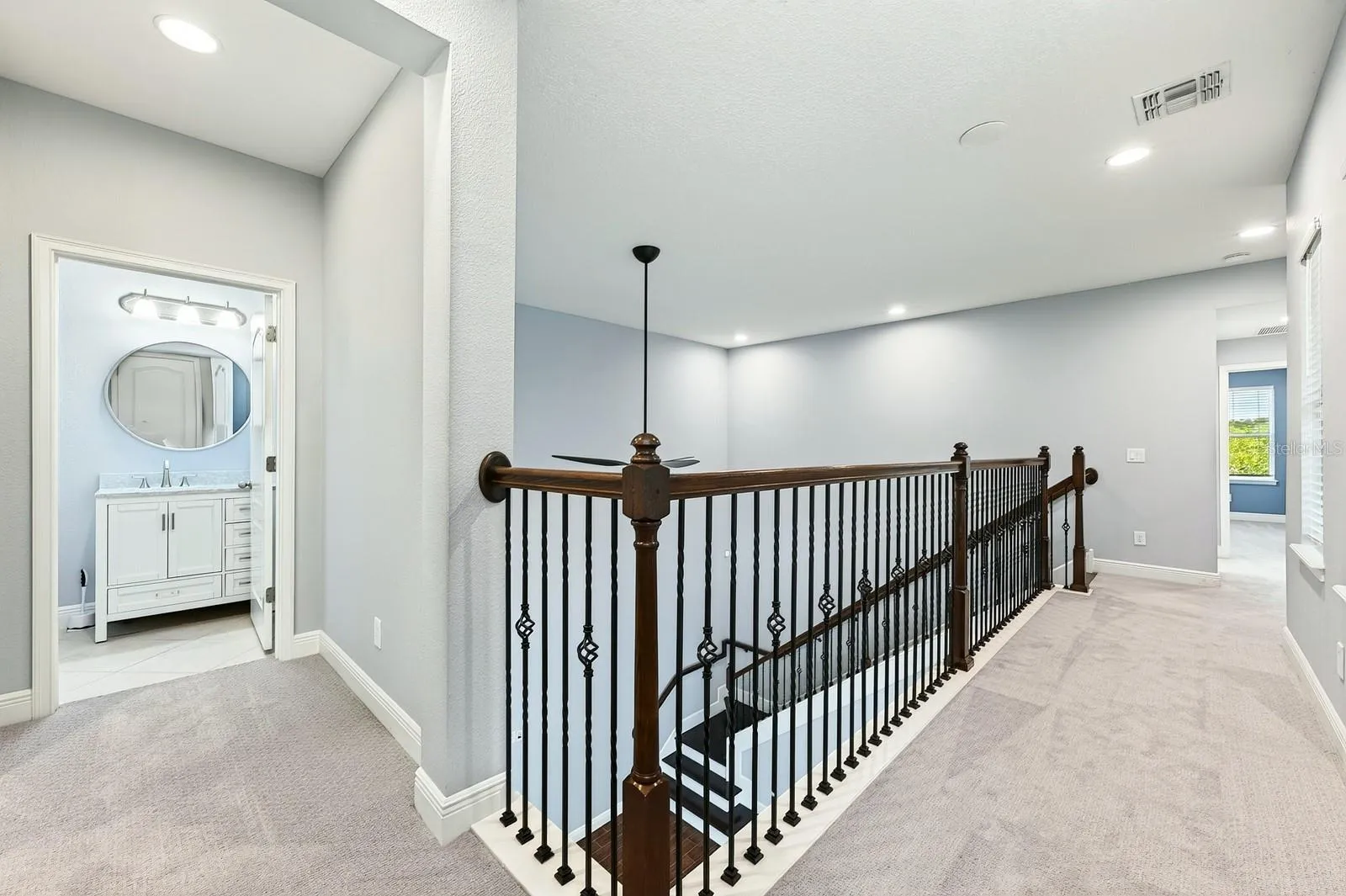 Second floor landing, catwalk views to the main floor.