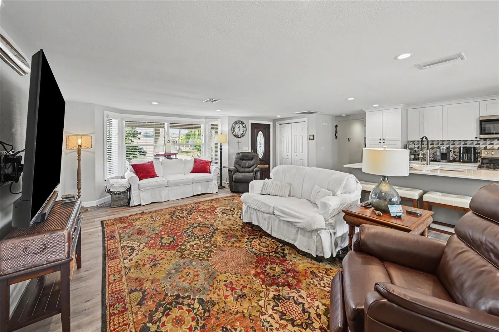 Bright living room featuring a bay window in Venice Gardens at 412 Redwood Road
