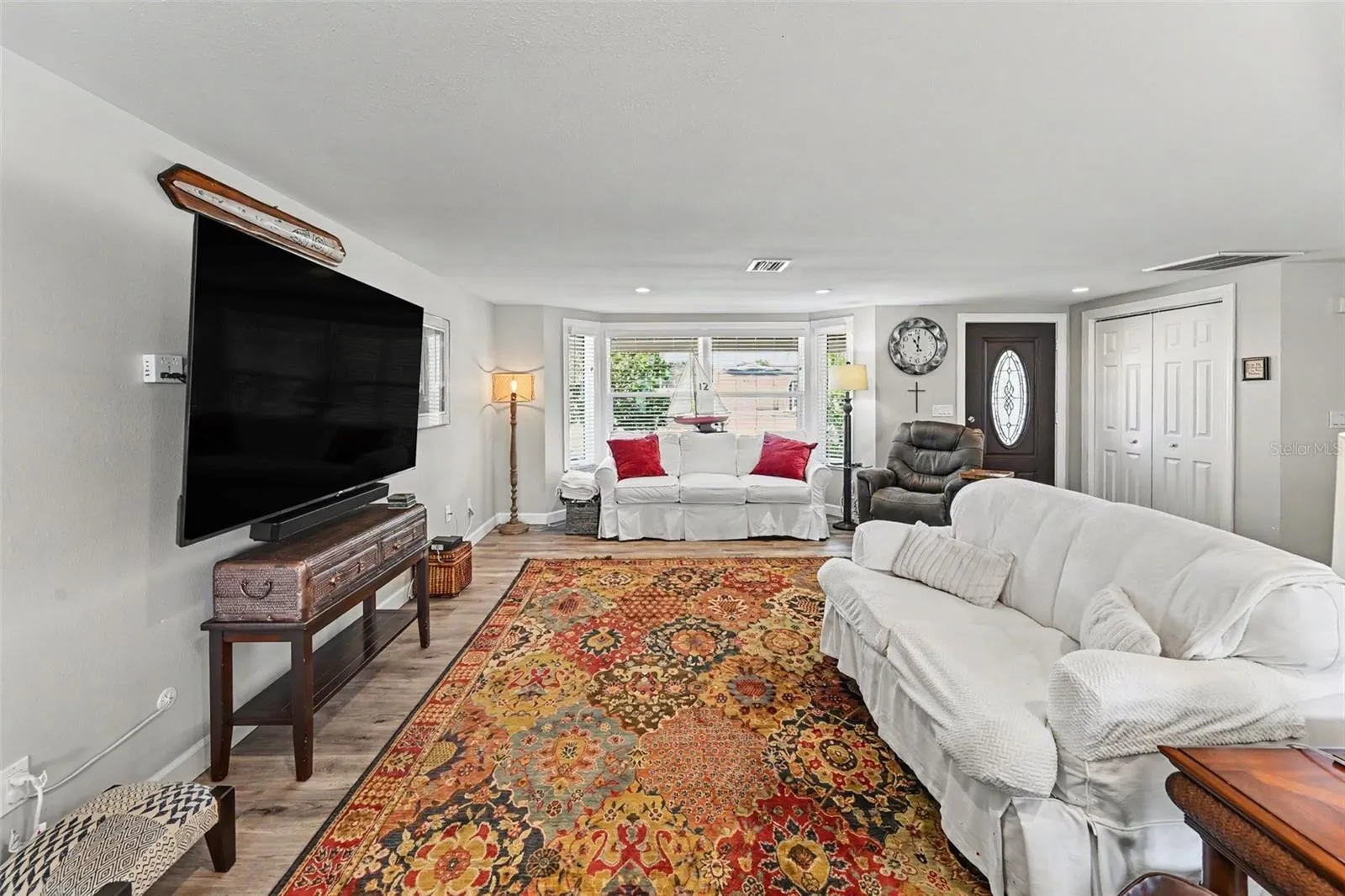 Open concept living, dining, and kitchen area at 412 Redwood Road, Venice, Florida