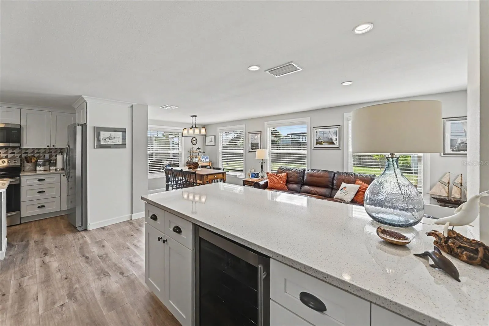 Wine cooler island featuring a quartz island, wine cooler at 412 Redwood Road, Venice, Florida