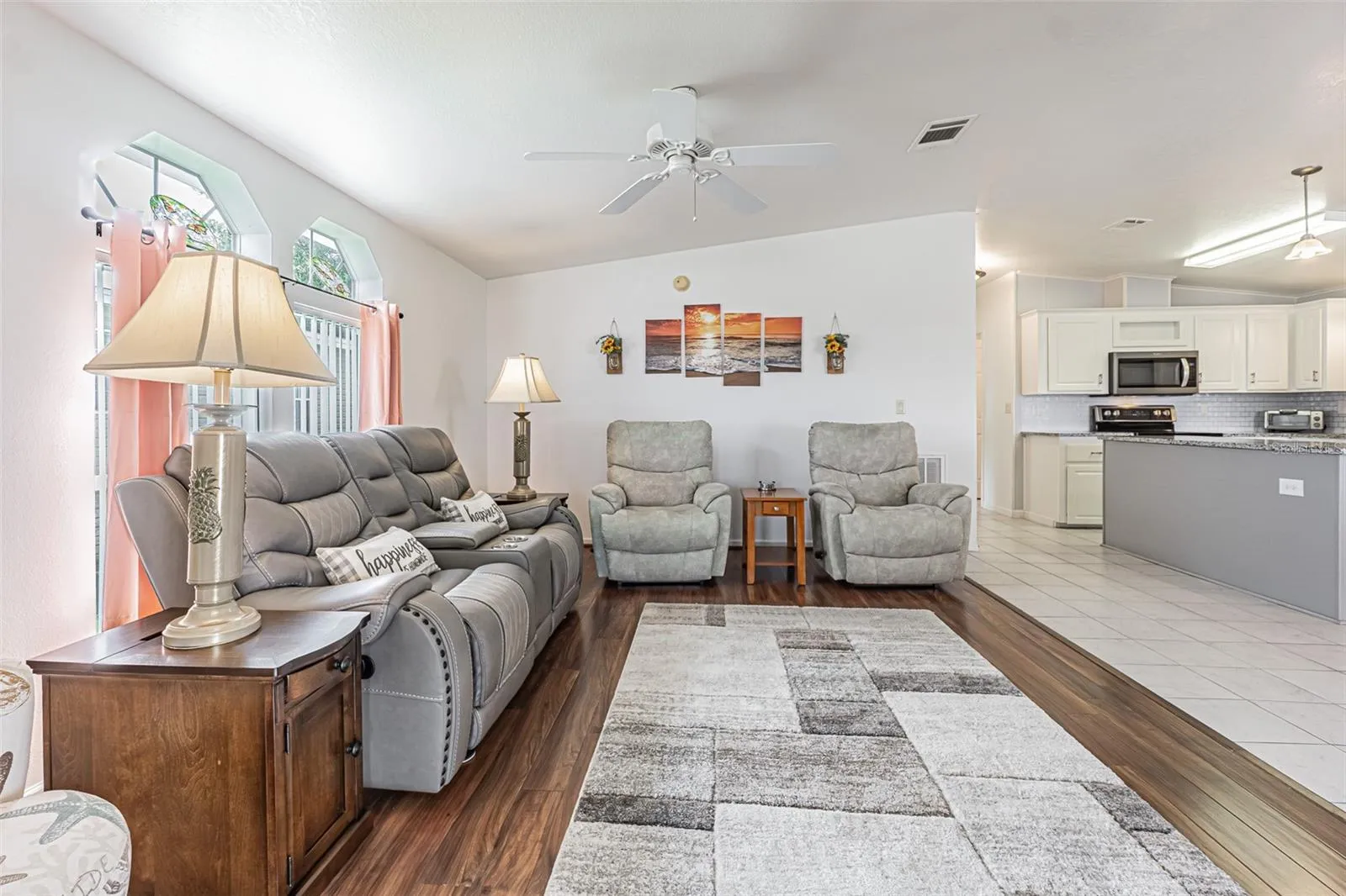 Warm wood floors and valuted ceilings in this light, bright home!