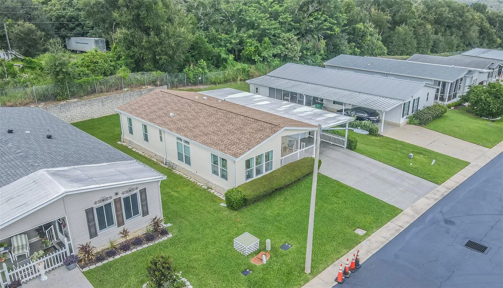 Newer roof, lush lawn, landscaped front and  private backyard