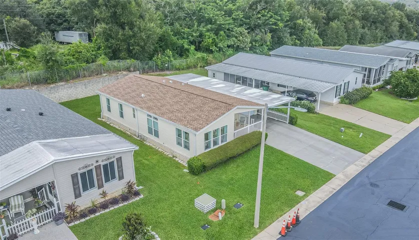Newer roof, lush lawn, landscaped front and  private backyard