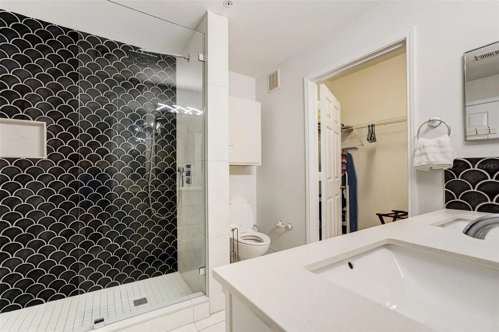 Primary bath with large walk in closet