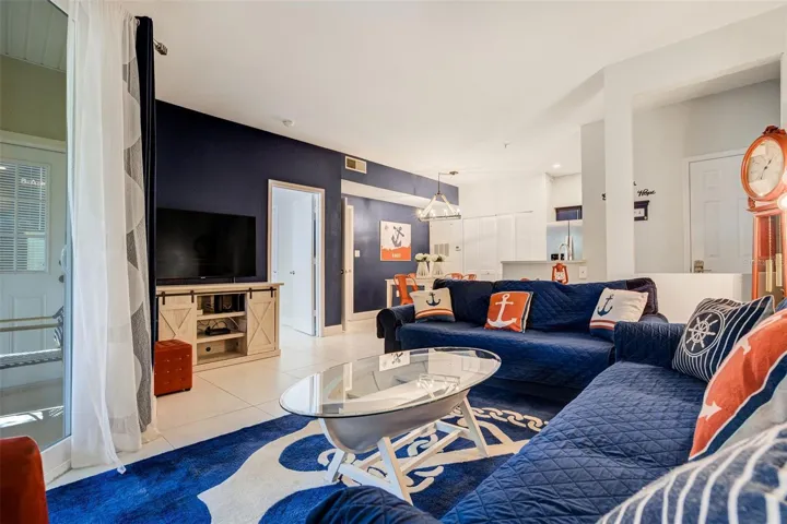Living room/dining room combo with impact slider to covered patio