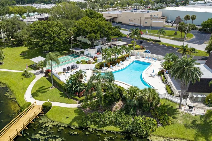 Heated pool, shuffle board courts and poolside of clubhouse