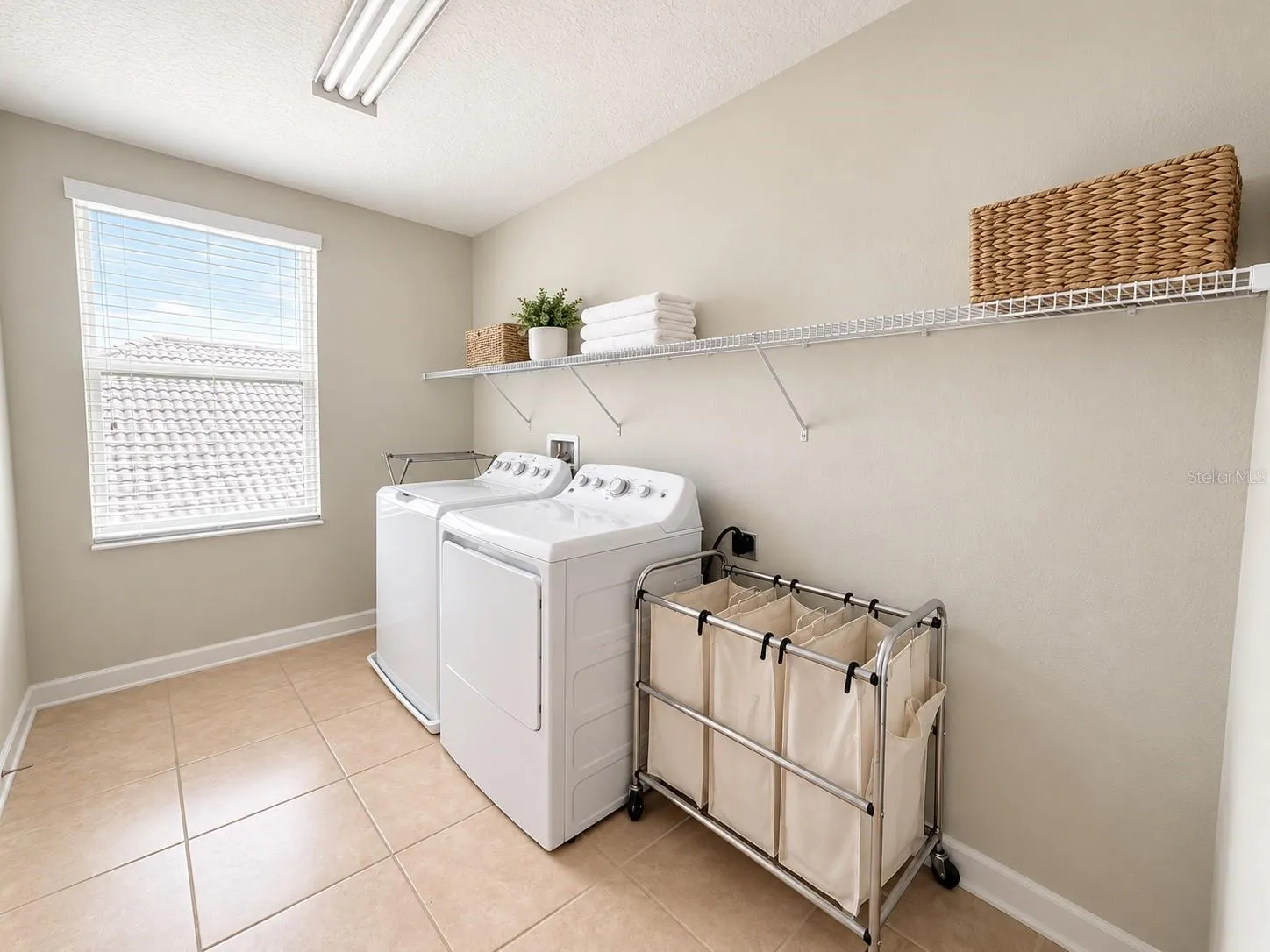 Dedicated laundry room adds everyday convenience and additional utility space. Conveniently located on the second floor.