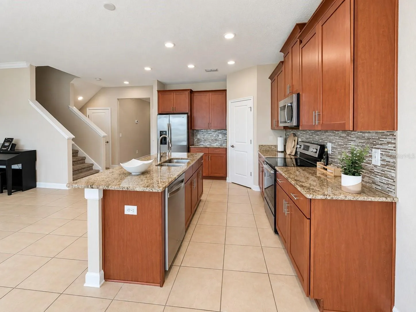 Large kitchen provides excellent prep space and a functional layout for everyday living and entertaining.
