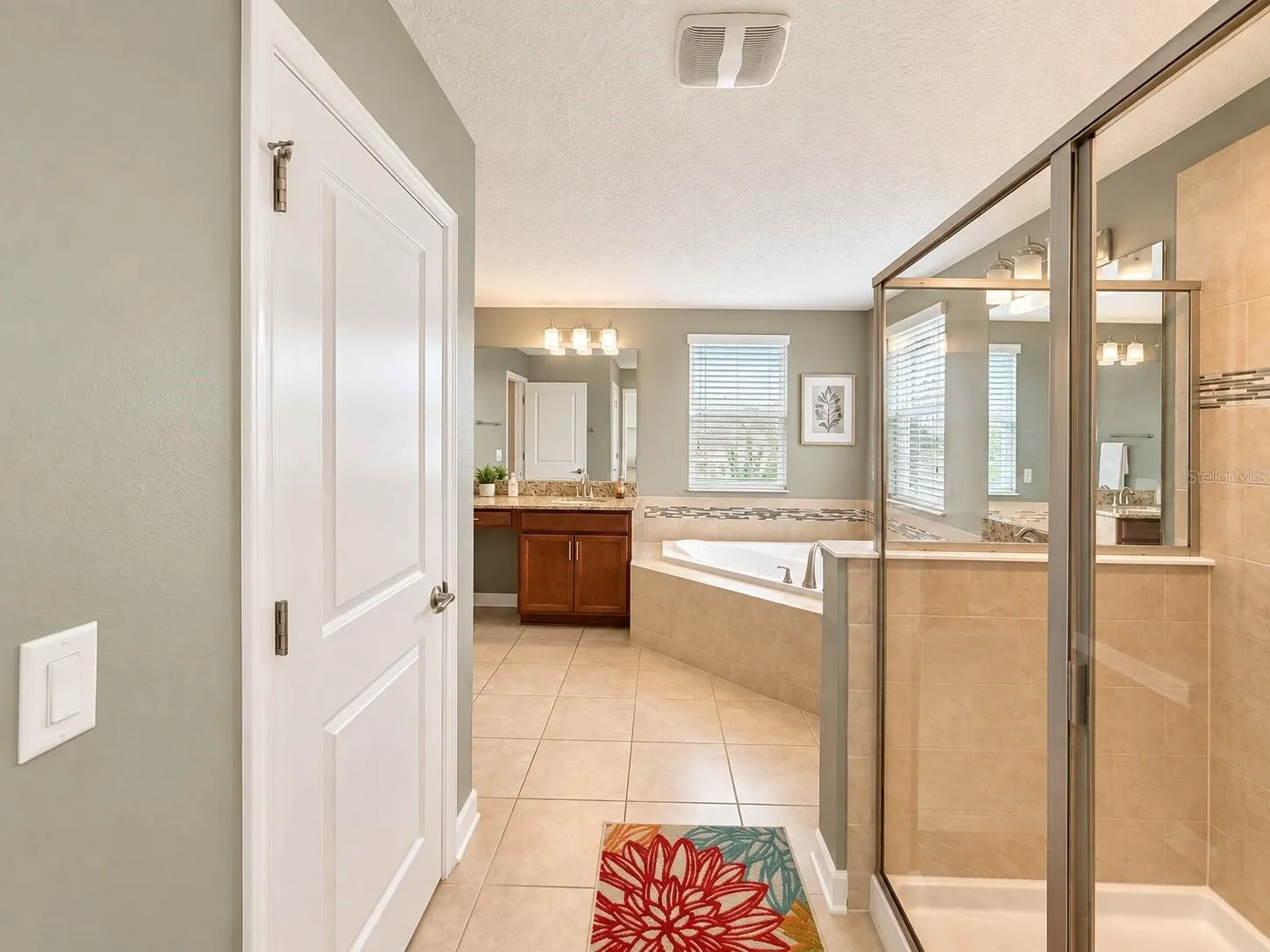 Generous vanity space provides plenty of room for storage and daily routines.