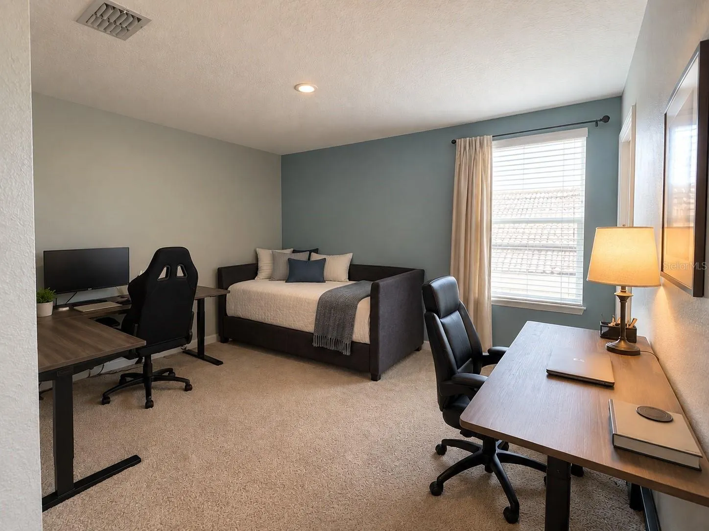 Well-proportioned fifth bedroom with ample closet space.