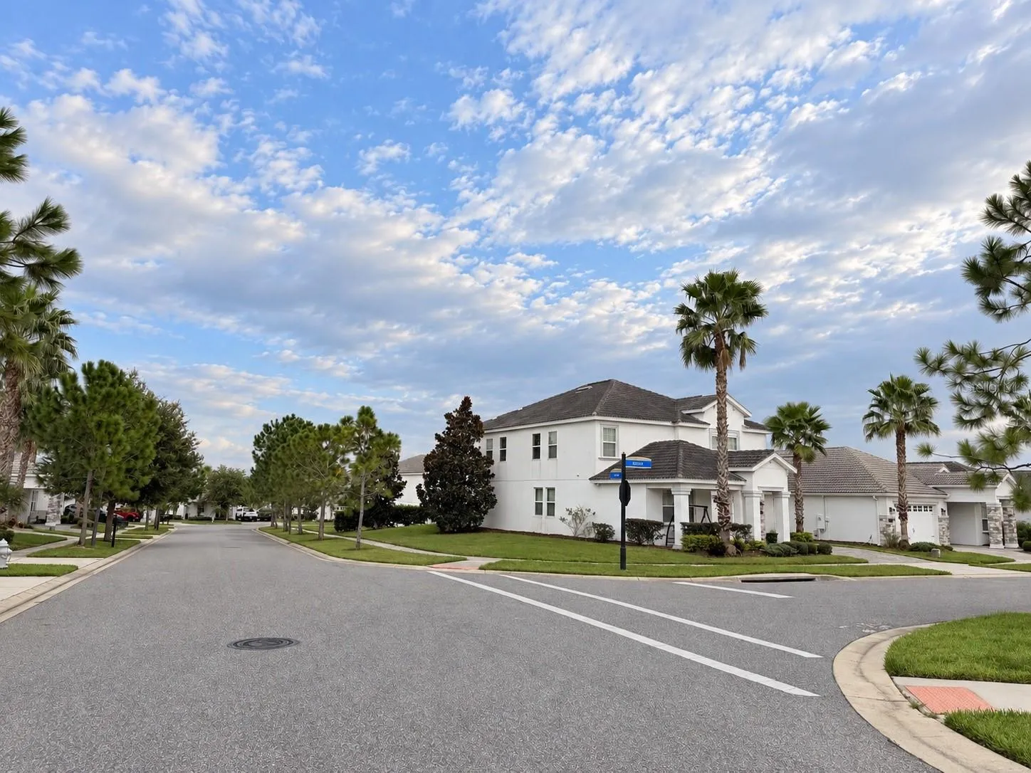 Street view showcasing the home's desirable corner-lot setting and surrounding community.
