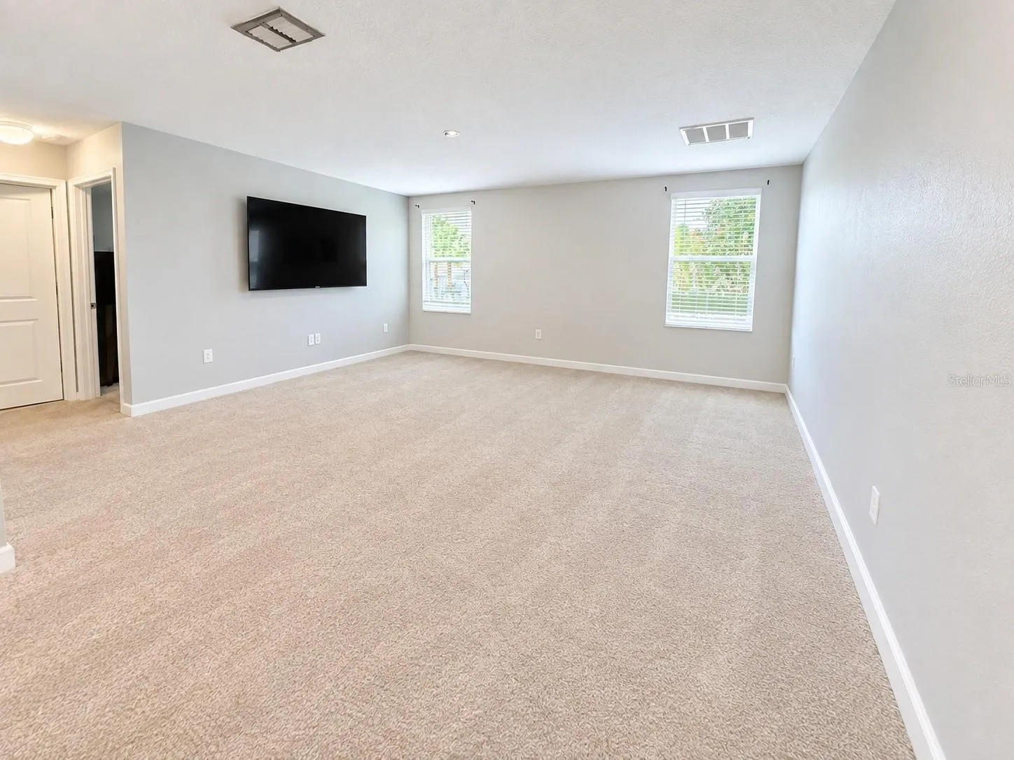 Versatile upstairs flex space provides additional room for a lounge, playroom, office or media area.