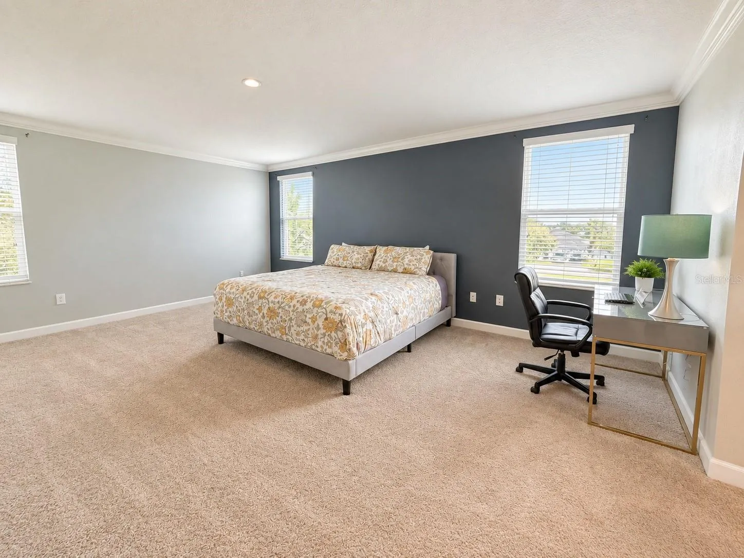 Generously sized primary suite with ample space for a complete bedroom retreat.