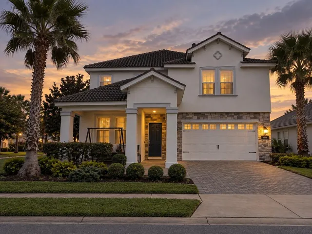 Twilight view highlighting the home's welcoming exterior and architectural details.