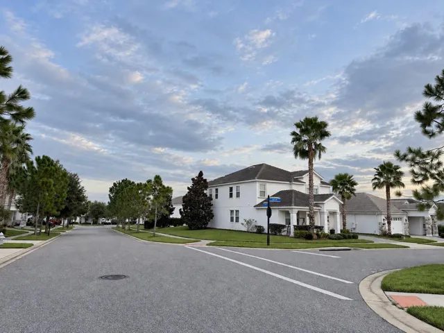 Expansive side yard highlights the additional outdoor space offered by the corner homesite.