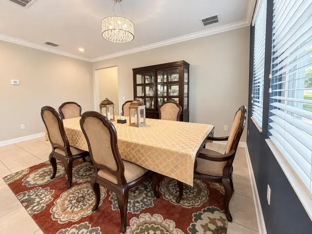 Spacious dining area conveniently positioned near the kitchen for effortless entertaining.