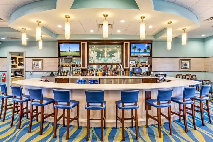 Spacious clubhouse bar offering comfortable seating and a relaxed resort-style atmosphere.