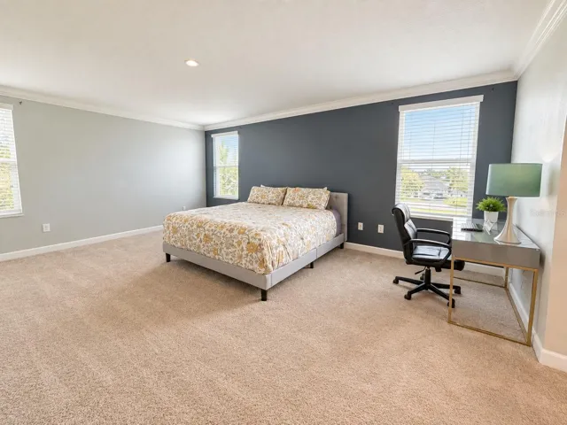 Generously sized primary suite with ample space for a complete bedroom retreat.