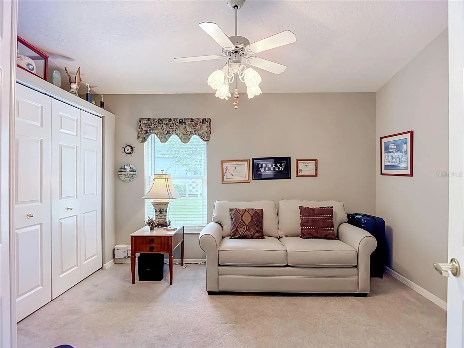 Bedroom 2 sits on carpet. Room has a lagre built in closet with a deep depth for larger suit cases oor other large items