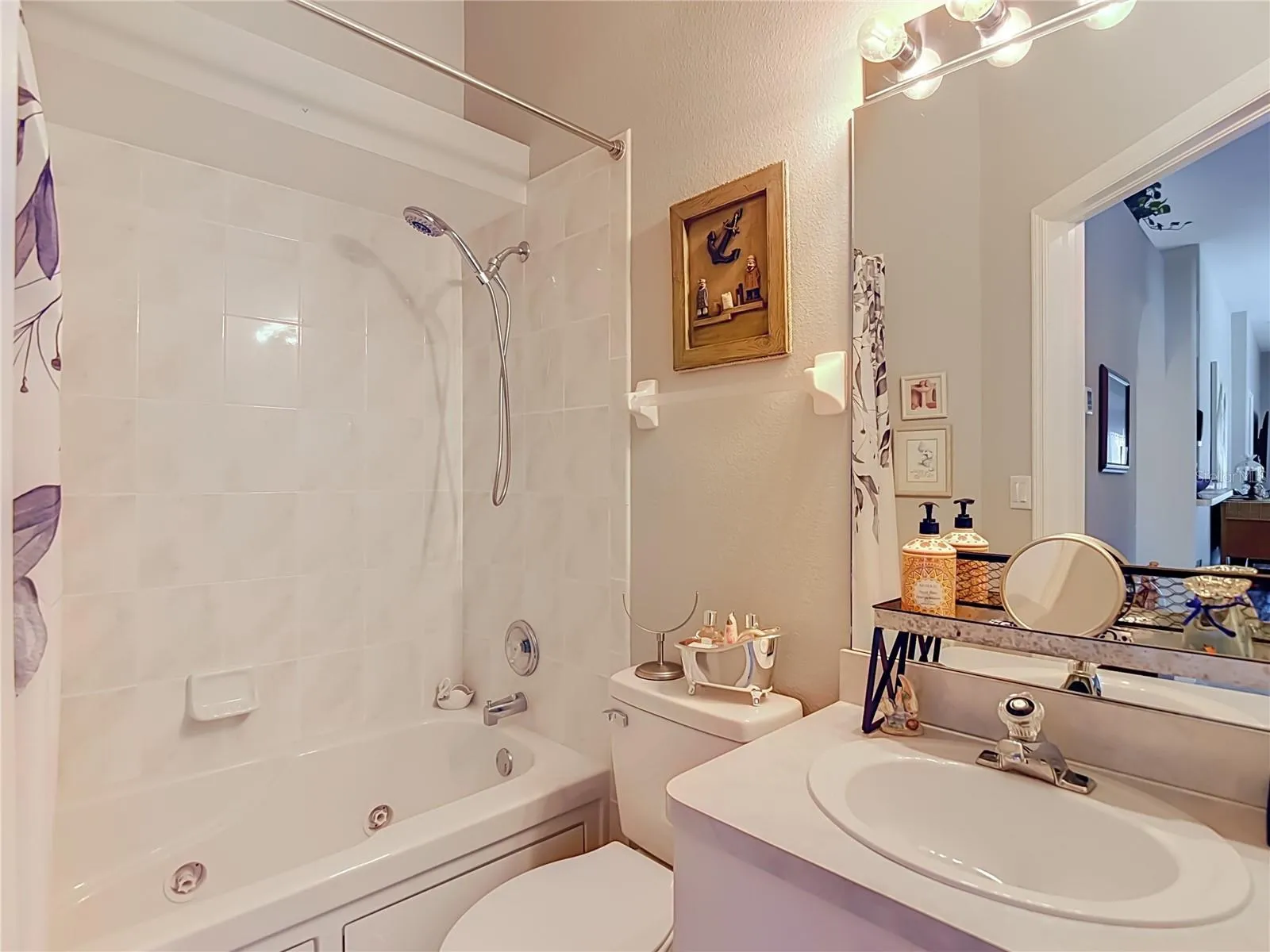 The seconday bathroom is convenient to Bedroom 2 and kitchen. Has combination tub and shower set up.