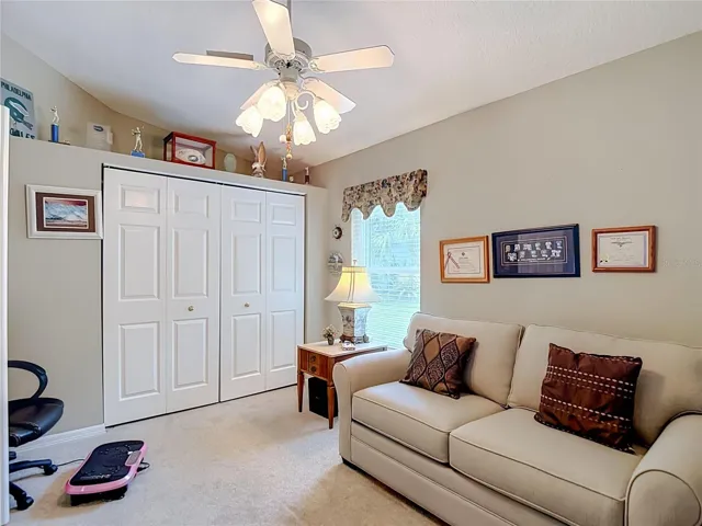 Presently being used as den this room could easily handle bedroom furniture if necessary. Additional  area above the closet for those special momentos.