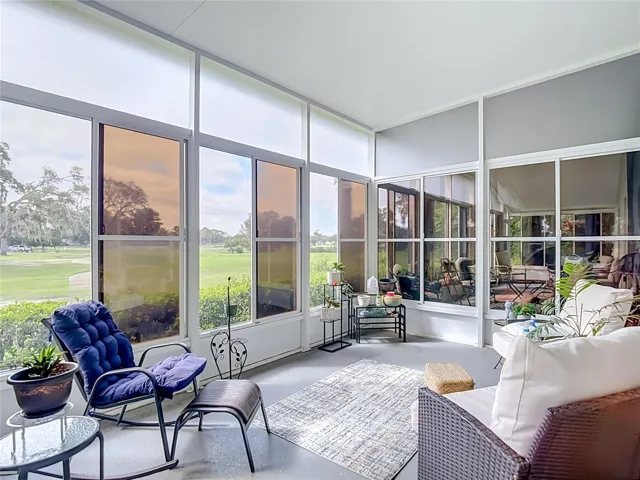 THe lanai patio is completly screen with vinyl sliding windows as well for privacy or to keep the rains from putting a damper on your plans for the day. The entire area is alsoroofed. What a great way to sit and watch the golfers on the 10th fairway.