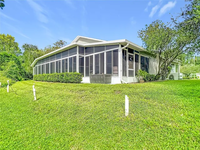 Rear view of the villa. The white stakes are markers for the golf course.